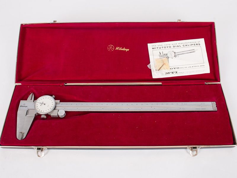 Genuine Mitutoyo dial caliper in its presentation case