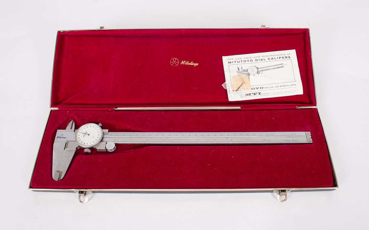 Genuine Mitutoyo dial caliper in its presentation case